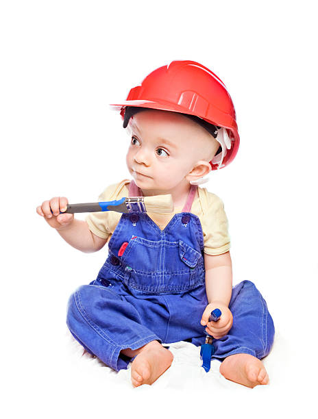 istock baby boy in a builder dress 153565543