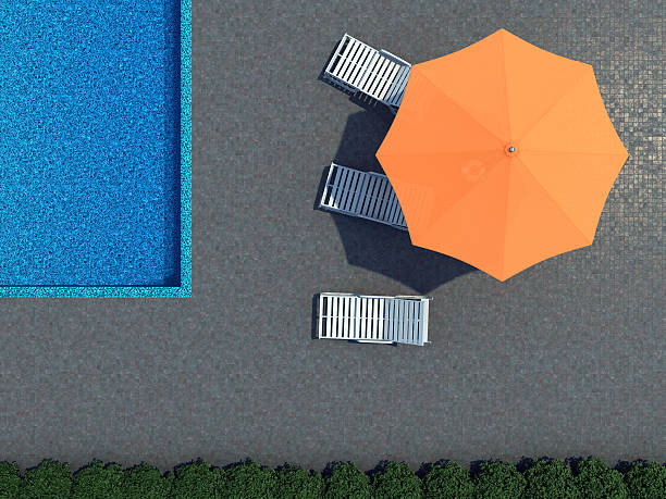 pool and sunshade topview High resolution 3d render of an Hotel swimming pool with beach-umbrella and three lounge-chairs in straight topview. beach umbrella stock pictures, royalty-free photos & images