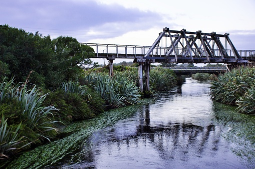 The Mahinapua railway bridge is a historical and disused wooden railway bridge crossing the Mahinapua Creek near Hokitika town on the West Coast of New Zealand's South Island. This railway bridge was used between 1905 to 1980.