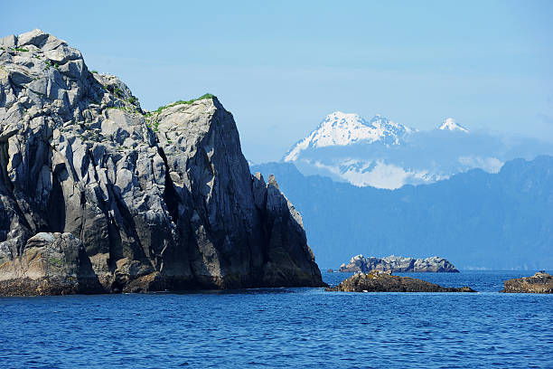 istock rock and mountain over ocean 153567491