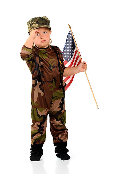 小型 homesick ミナミコメツキ - child military saluting flag ストックフォトと画像