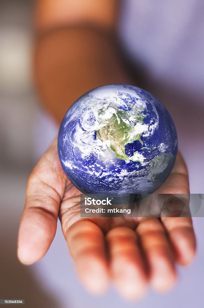 saving earth image composite of earth on palm, for conceptual usage. Adult Stock Photo