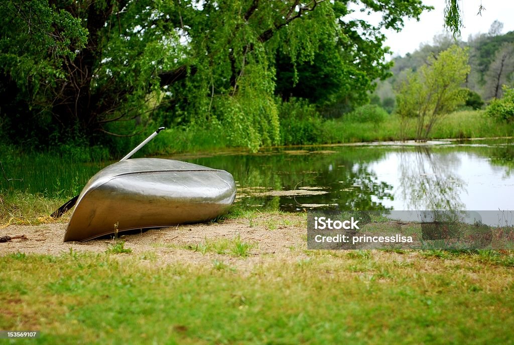 Canoe in Peaceful Setting A canoe awaiting you. California Stock Photo