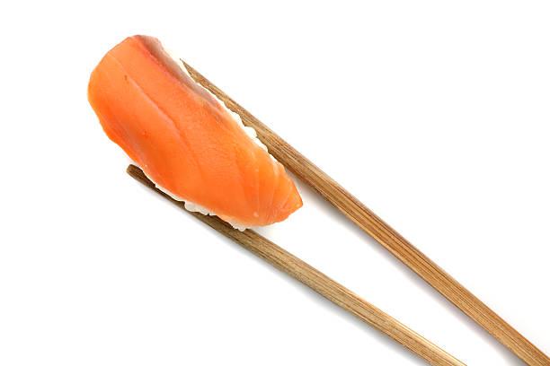 istock Salmon sushi with chopsticks 153569285