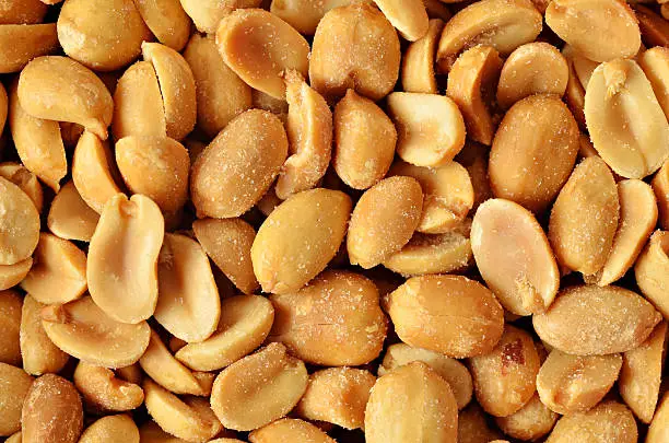 A close up of salted peanuts