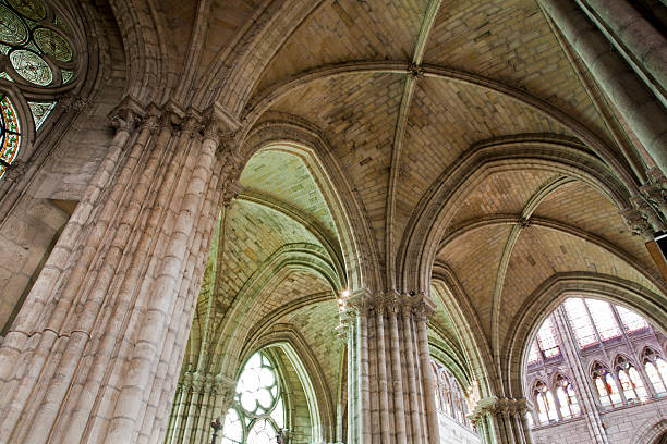 Cathedral interior with repeating stone arches and high vaulted ceilings