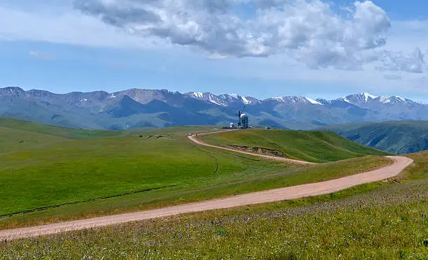 Asy Plateau and the road to the High-altitude Observatory at the background of Tien-Shan Mountains. Kazakhstan..