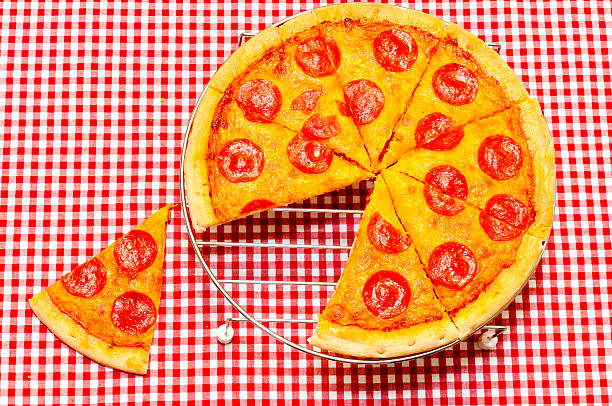 istock Whole Pepperoni Pizza with Slice Removed 153571086