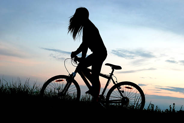 istock mountain biker girl silhouette 153571096
