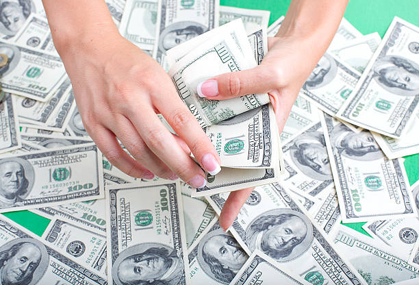 istock female hand recount money 153571334