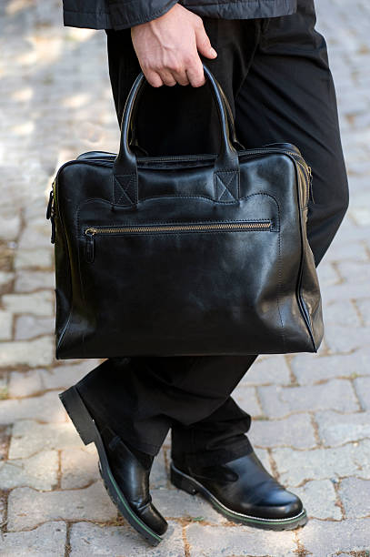 istock A man carrying a messenger bag 153572324