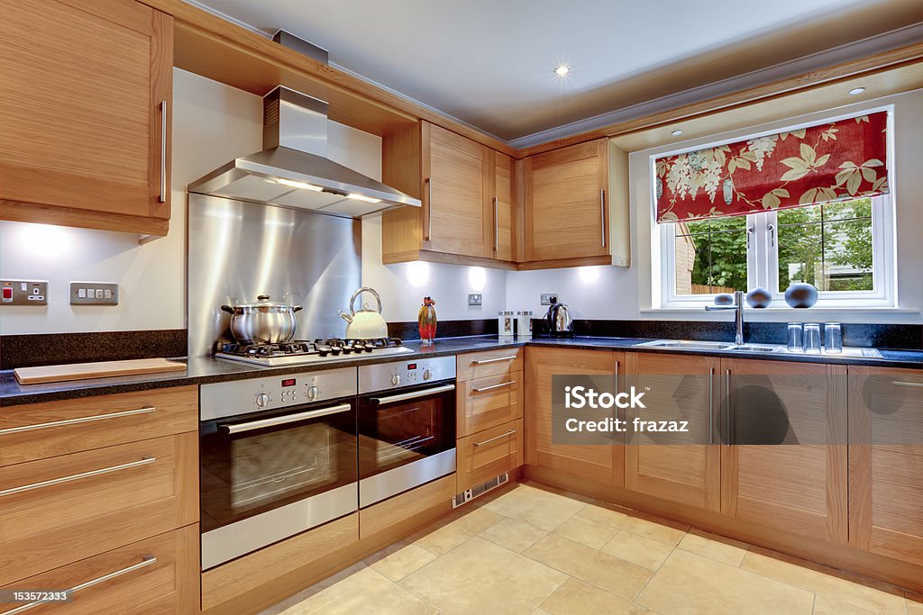 Luxury Modern Kitchen Luxury modern fitted kitchen with stainless steel appliances, granite work surfaces and two ovens Appliance Stock Photo