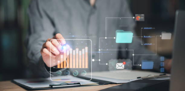 istock statistical analyst reading graph report and business statistics charts ,Analysis and improvement of corporate strategy ,manage financial and marketing documents , Statistics and Data Concepts 1535724958