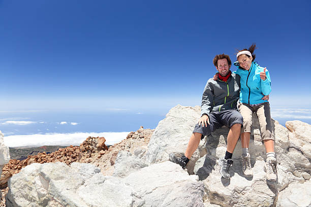 istock People on mountain top hiking 153572716