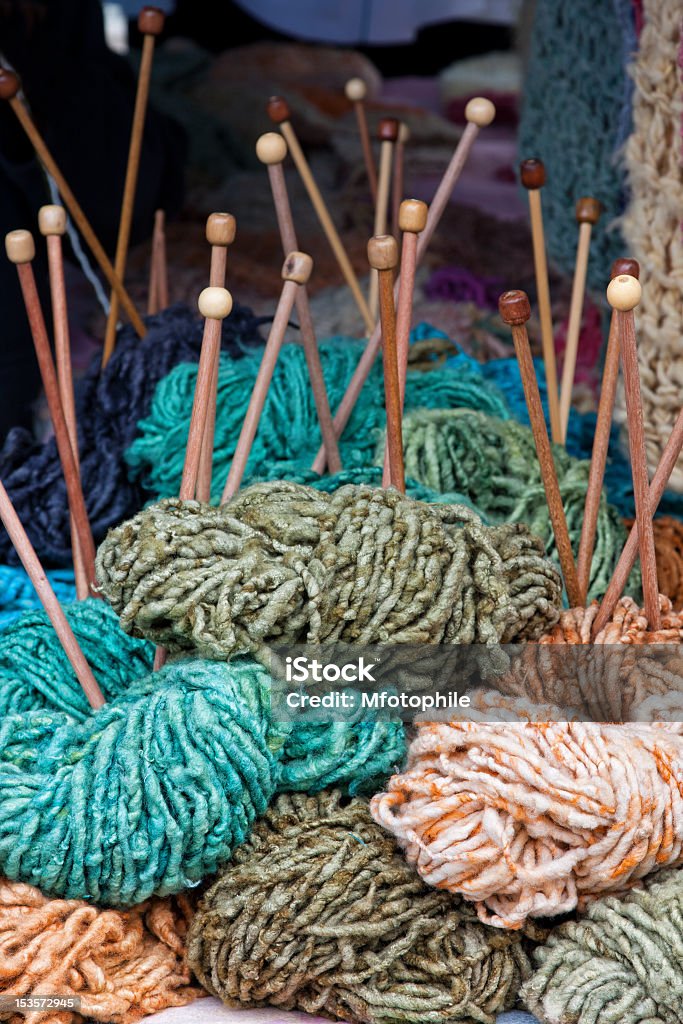 needles and wool balls of colored wool with knitting needles Art And Craft Stock Photo