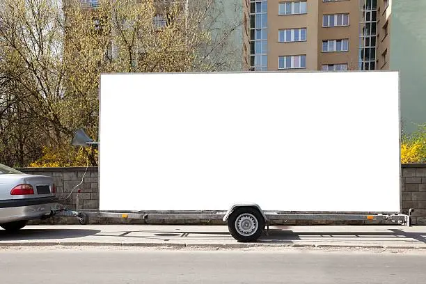 Blank billboard on car trailer