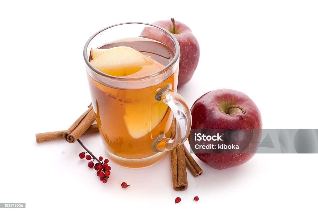 apple cider cup od apple cider and rolls of cinnamon Hot Apple Cider Stock Photo