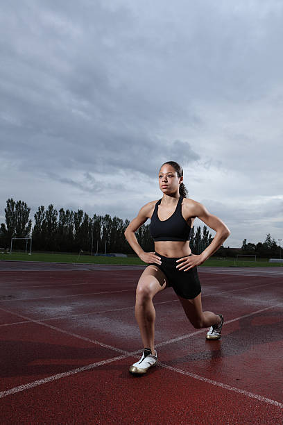 istock Lunge exercise for quadriceps by athlete on track 153573419