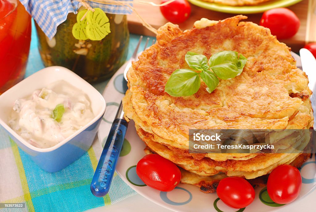 potato pancakes plate of potato pancakes with creamy cheese and vegetables dip Appetizer Stock Photo