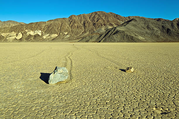 Racetrack Playa, Death Valley National Park, California. "Racetrack Playa, Death Valley National Park, California. The Racetrack Playa, or The Racetrack, is a scenic dry lake feature with ""sailing stones"" that leave linear ""racetrack"" imprints.            " racetrack playa stock pictures, royalty-free photos & images