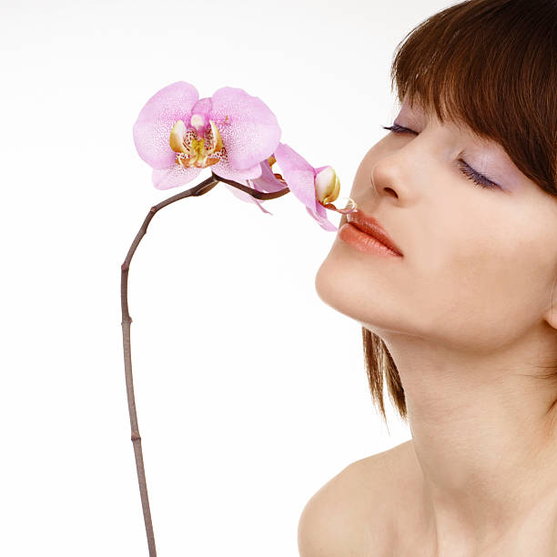 woman with an orchid stock photo