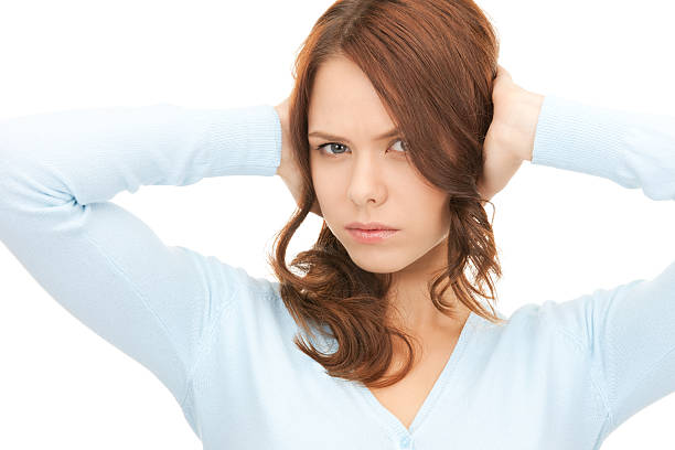 istock woman with hands on ears 153574583
