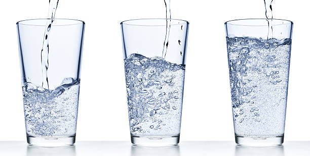 istock pouring water into glass 153574643