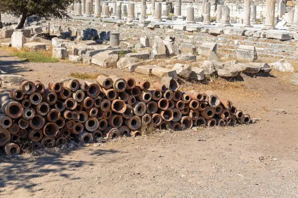 Photo of Roman terracota pipes. Result of archeology excavation. Ancient water supply system. Ancient Ephesus, magnificient ruined city near Selcuk (Izmir region), Turkey (Turkiye)