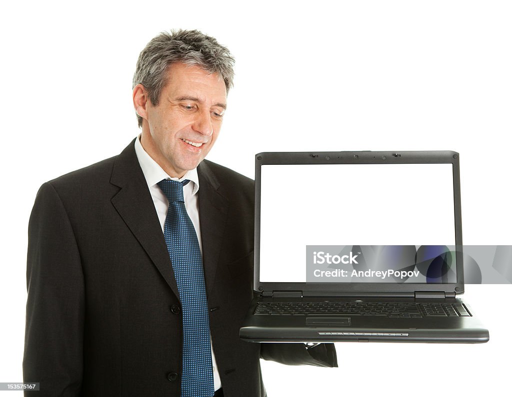 Деловой человек, представляя laptopn - Стоковые фото Активный пенсионер роялти-фри