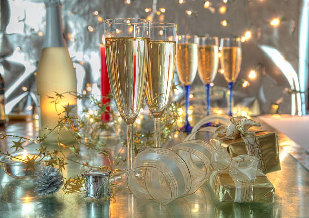 istock Champagne in glasses,candles and twinkle lights. 153575188