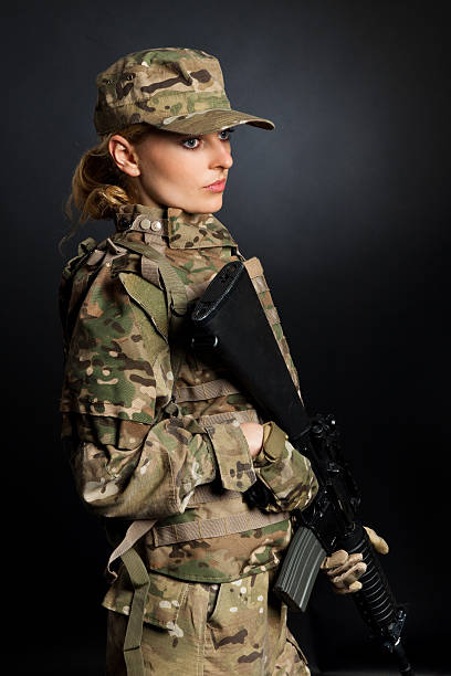 istock Army girl with rifle 153575307