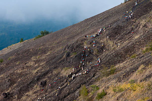 istock Balinese Hindus walking up Mt. Batur 153575496
