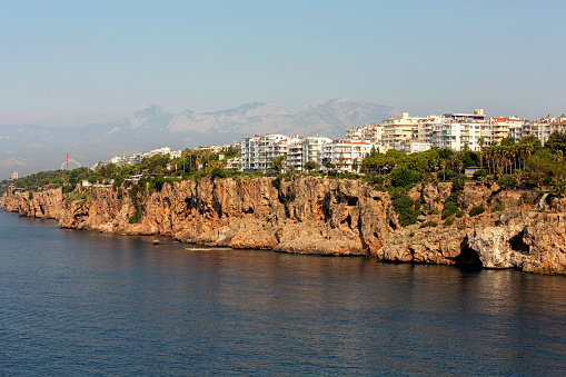 Panorama of skyline and coast of Antalya with mountains in the background. Famouse tourist city in Turkey (Turkye)