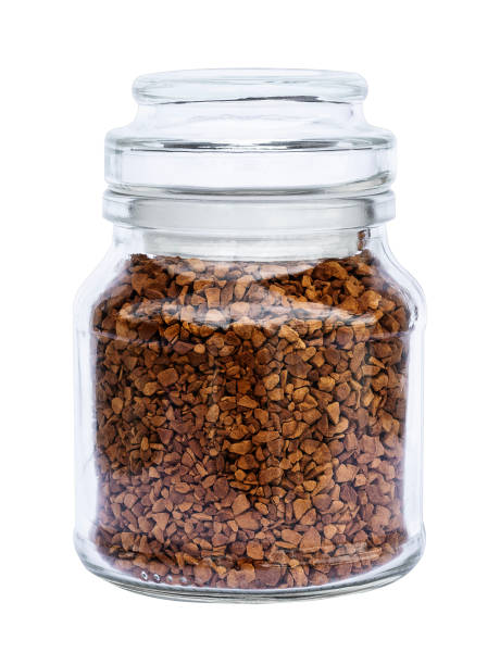 istock Ground coffee beans in bottle isolated on white background with clipping path 1535758867