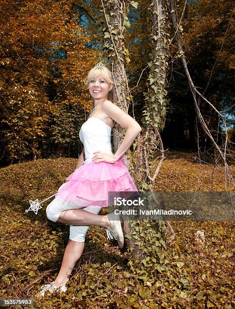 Woman Leaned Onto A Tree Stock Photo - Download Image Now - Adolescence, Adult, Adults Only