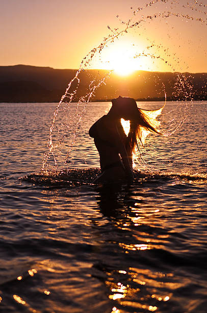 istock Girl Bathing at Sunset 153577066