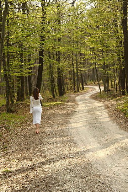 istock Girl walking in forest 153577181