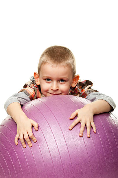 istock Cute boy playing with fit ball 153577286