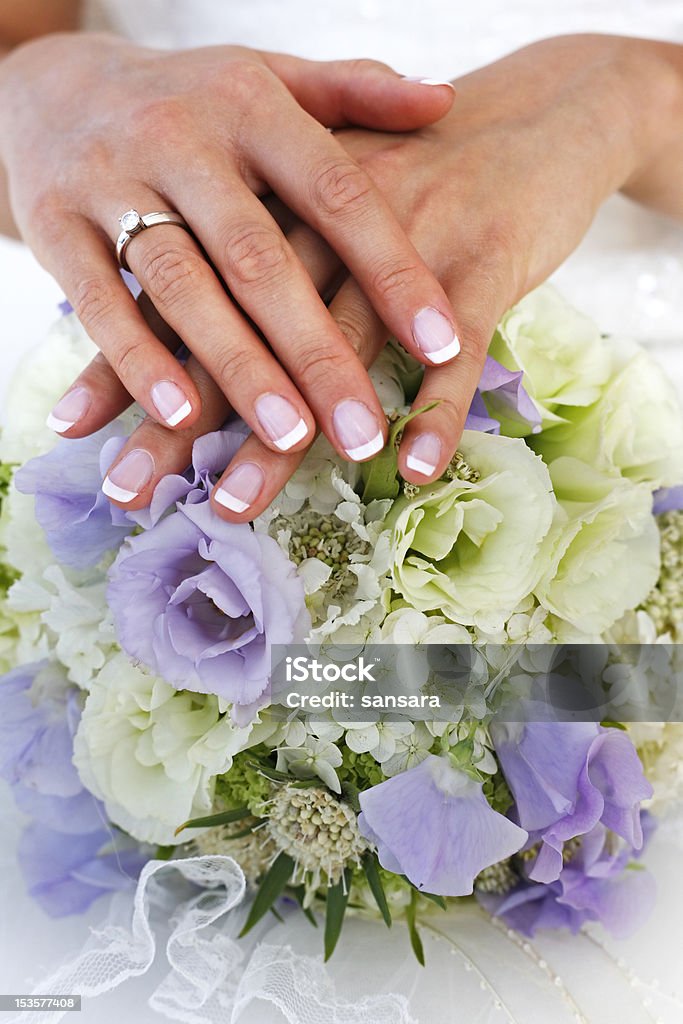 Wedding bouquet The bride holds a wedding bouquet Adult Stock Photo