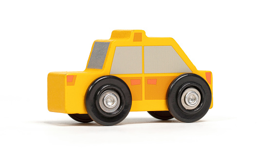 Retro wooden toy car isolated on a white background