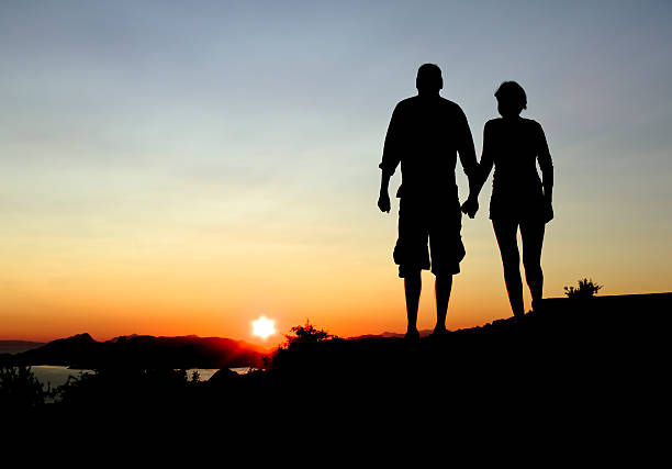 Couple watching the sunset. stock photo