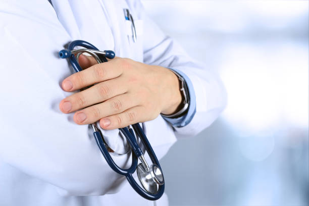 istock Portrait an unknown male doctor holding a stethoscope 1535781010