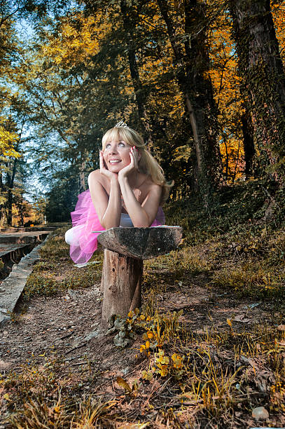 istock Dreamy woman lying on bench 153578387