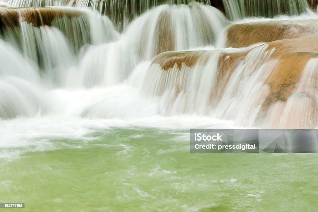 falling water falling water, kuang si waterfall in Laos Blurred Motion Stock Photo