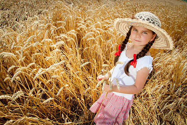 istock pigtailed girl in wheat 153579559