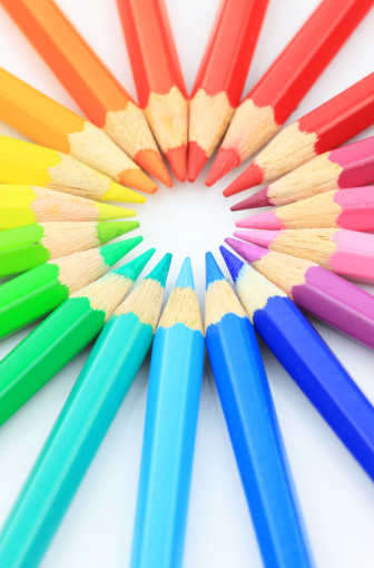  Color pencils arranged in a white background