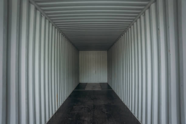 istock Empty inside cargo container at a harbor. Logistics concept inside the shipping, import, and export industries. 1535831547
