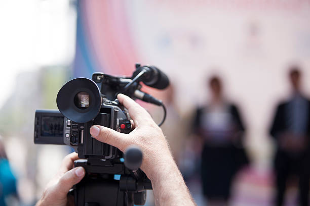 istock Covering an event with a video camera 153586791
