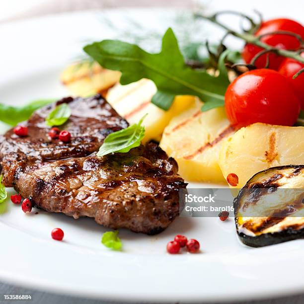 Grilled Steak Flavoured With Pink Pepper And Basil Stock Photo - Download Image Now - Basil, Beef, Cherry Tomato