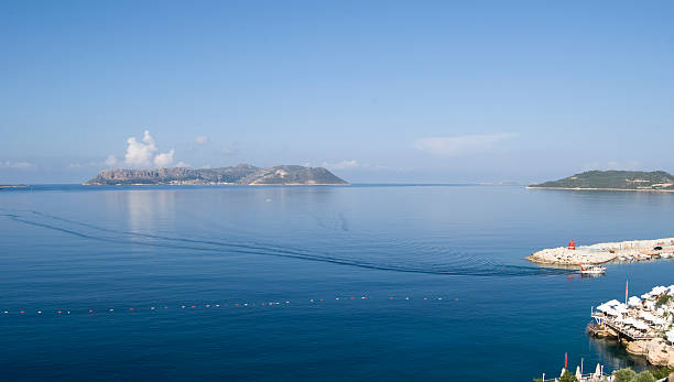 Boat arriving in Kas port stock photo